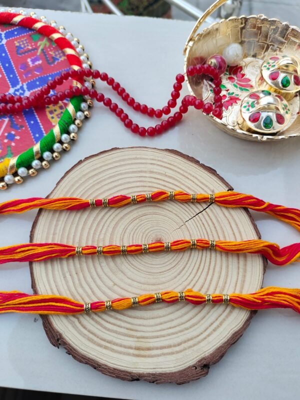 Vibrant Red & Yellow Thread Rakhi with Golden Beads - Classic Bhai Rakhi Set