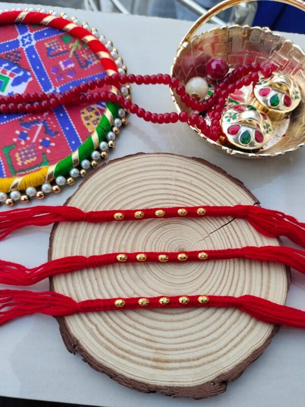 Classic Red Thread Rakhi with Golden Beads - Traditional Bhai Rakhi Set - Image 3