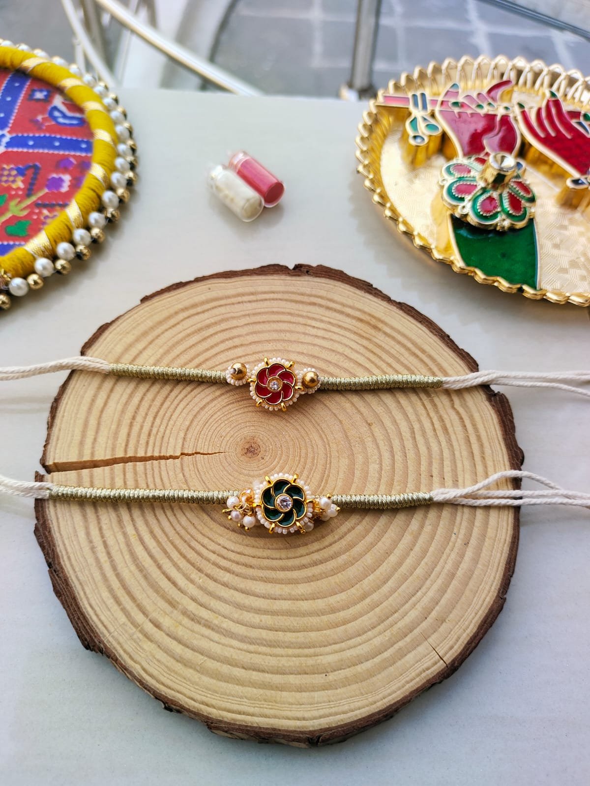 Floral Meenakari & Pearl Designer Rakhi Collection