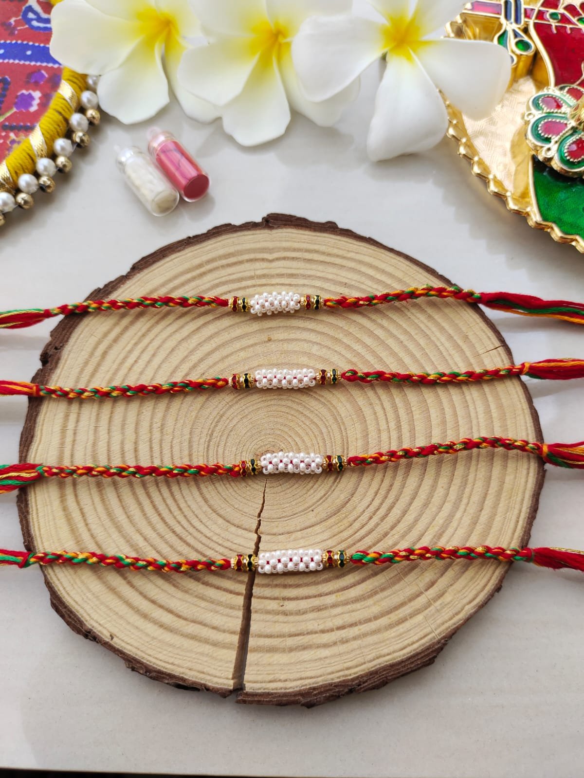 Handcrafted Cylindrical Pearl Cluster Designer Rakhi Collection - Image 2