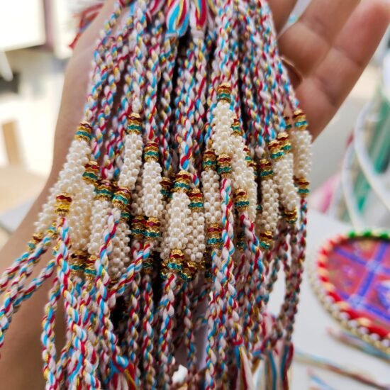 Handcrafted Cylindrical Pearl Cluster Designer Rakhi Collection