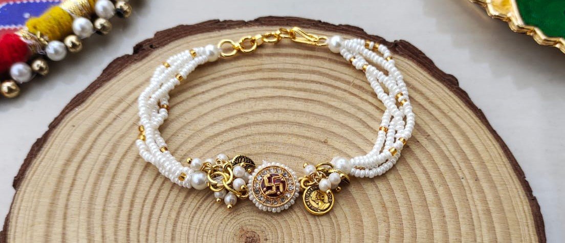 Sacred Swastika & Multi-Strand Pearl Bhaiya Bhabhi Rakhi Combo Set - Image 3