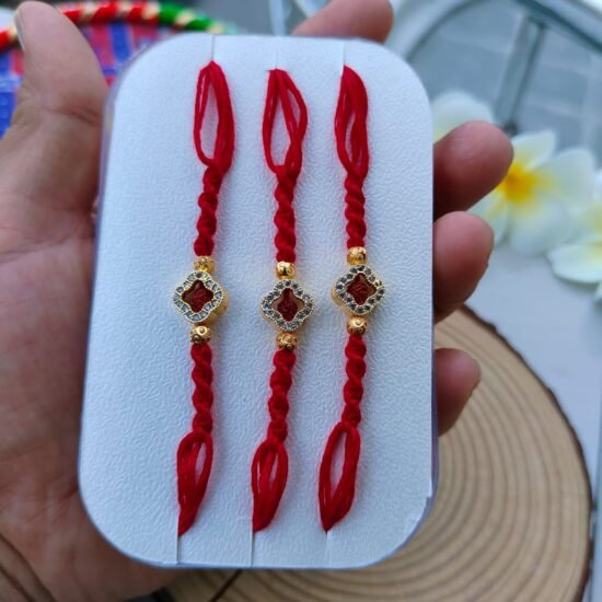 Auspicious Om Flower Diamond Style Quatrefoil Dial Designer Rakhi (Single Piece)