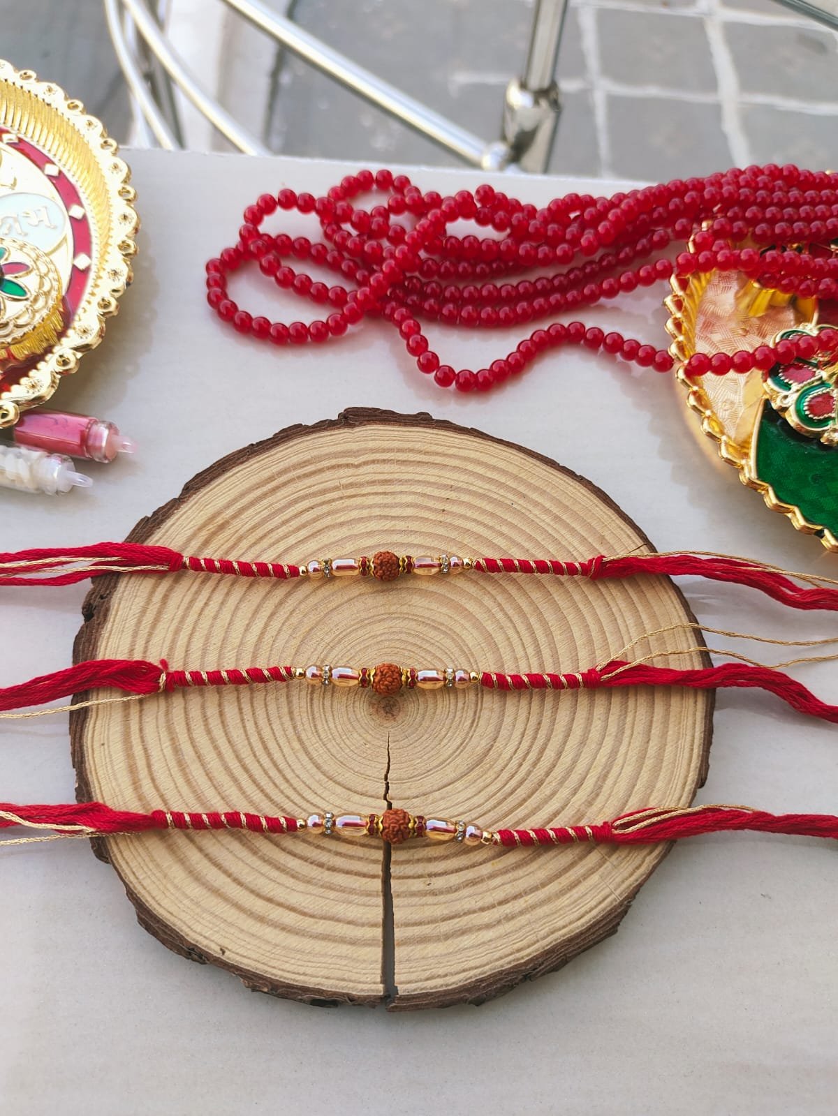 Minimalist Sacred Rudraksha Golden-Zari Red Thread Designer Rakhi (Single Piece) - Image 4