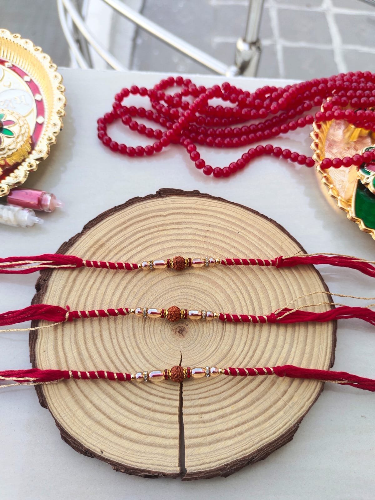 Minimalist Sacred Rudraksha Golden-Zari Red Thread Designer Rakhi (Single Piece) - Image 2