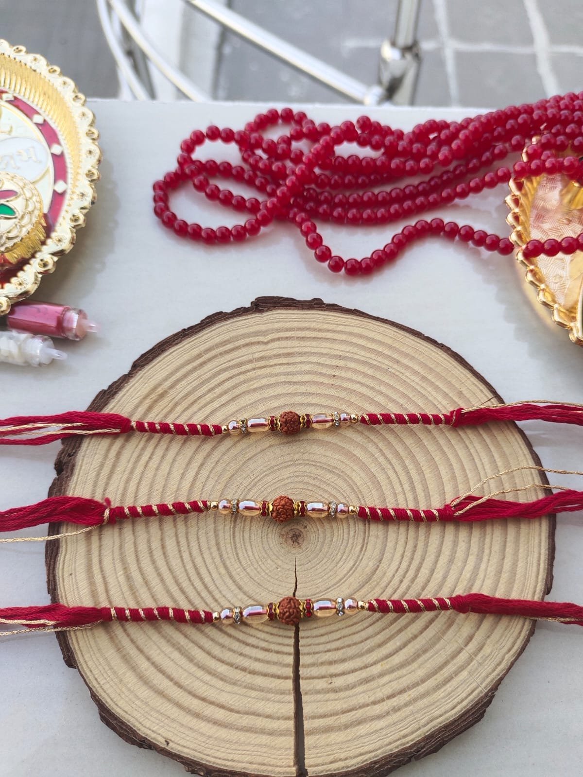 Minimalist Sacred Rudraksha Golden-Zari Red Thread Designer Rakhi (Single Piece) - Image 3