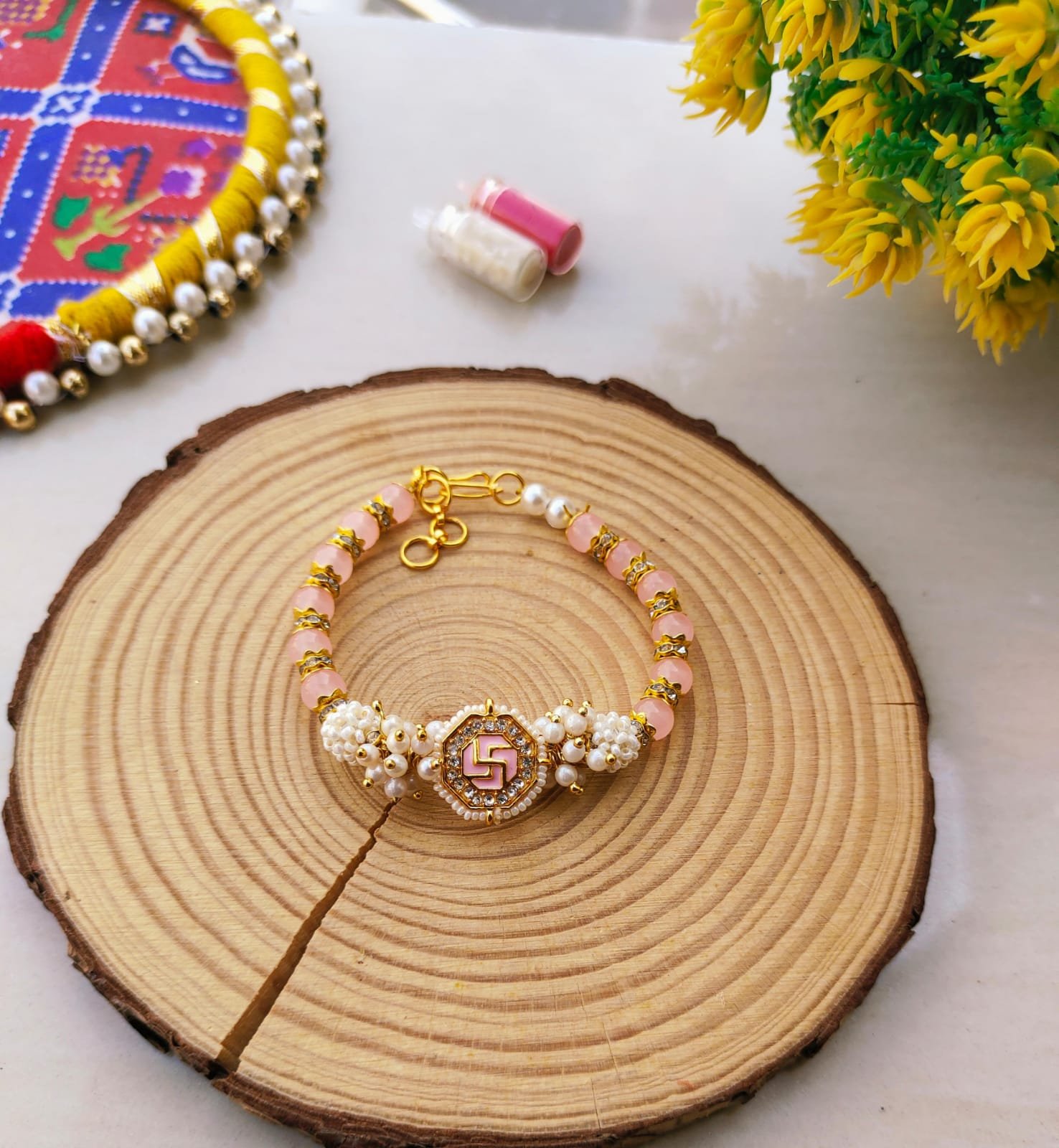 Pastel Pink Swastik Beaded Lumba Bracelet Rakhi for Bhabhi - Image 2