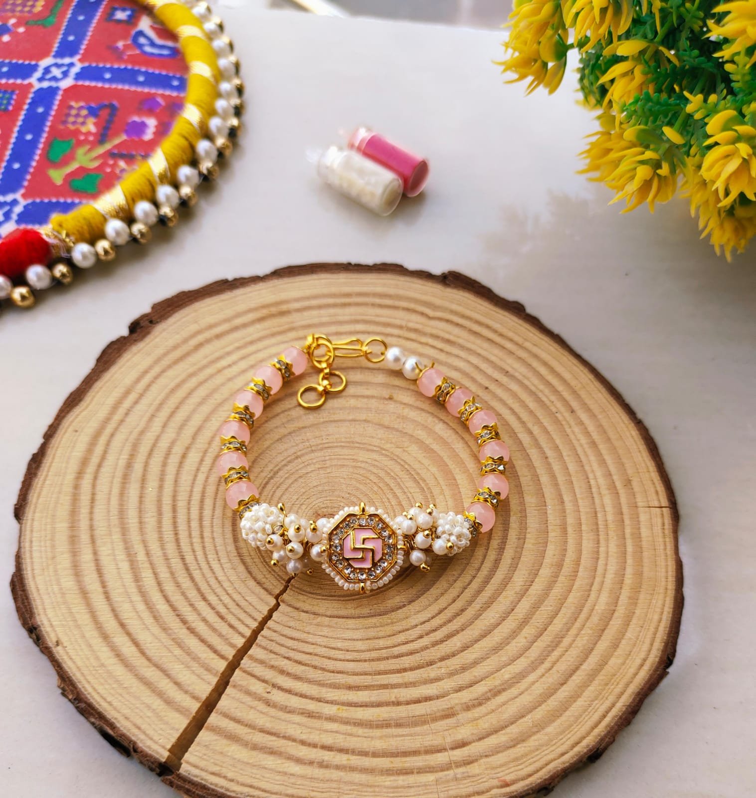 Pastel Pink Swastik Beaded Lumba Bracelet Rakhi for Bhabhi